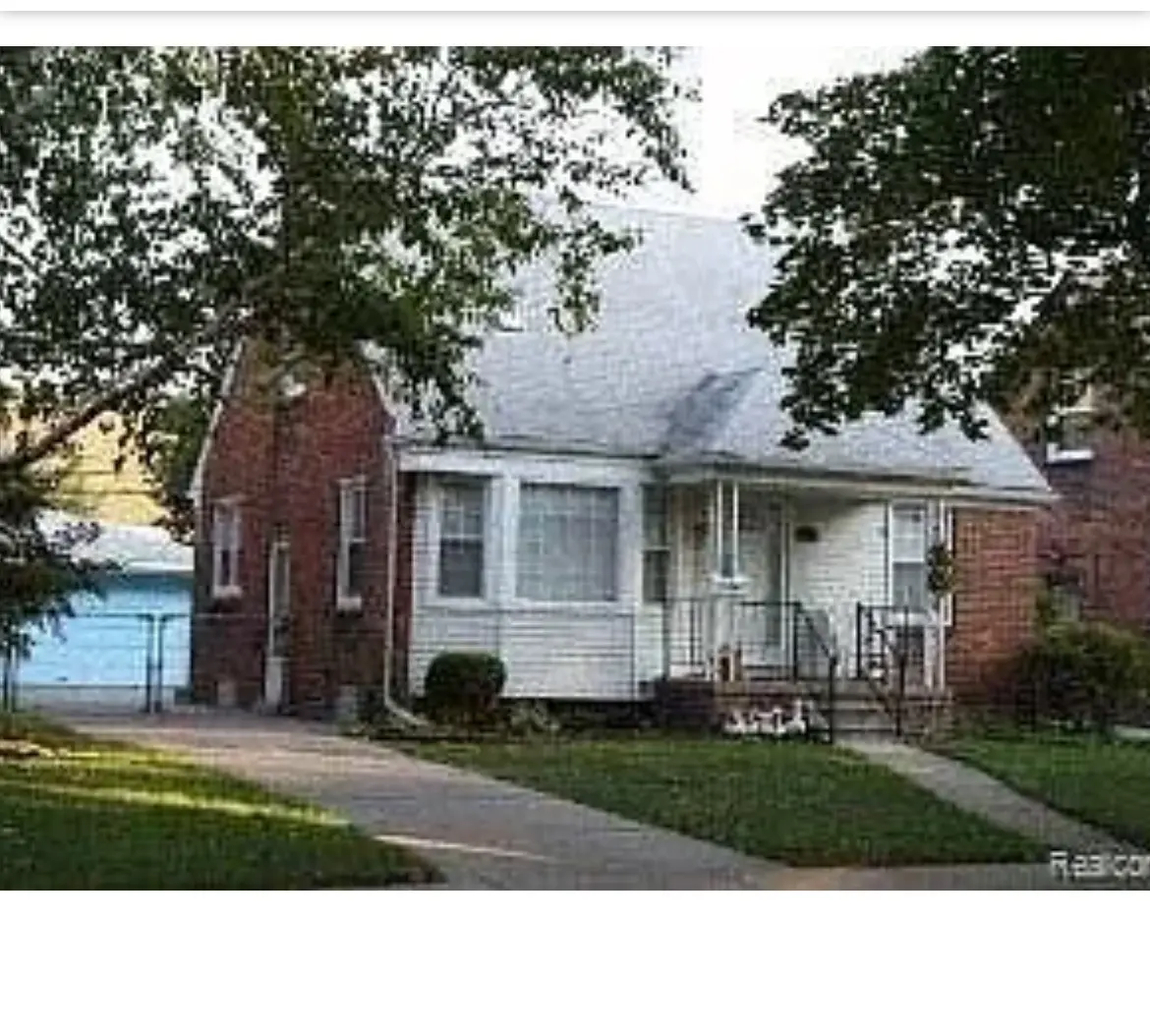 <p>Generate a highly realistic image of a modernized and functional exterior of a small suburban home. It should feature an updated entrance with a wooden deck and a sleek metal railing. The house is surrounded by enhanced landscaping, including well-groomed bushes and a small garden. The exterior of the home incorporates modern siding and energy-efficient windows. Above, the home has a compact, cottage-style roof. The estimate for the dimensions of the front area is approximately 20 feet by 15 feet.</p>